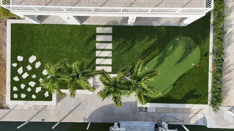 After: turf, putting green, paver path and planting