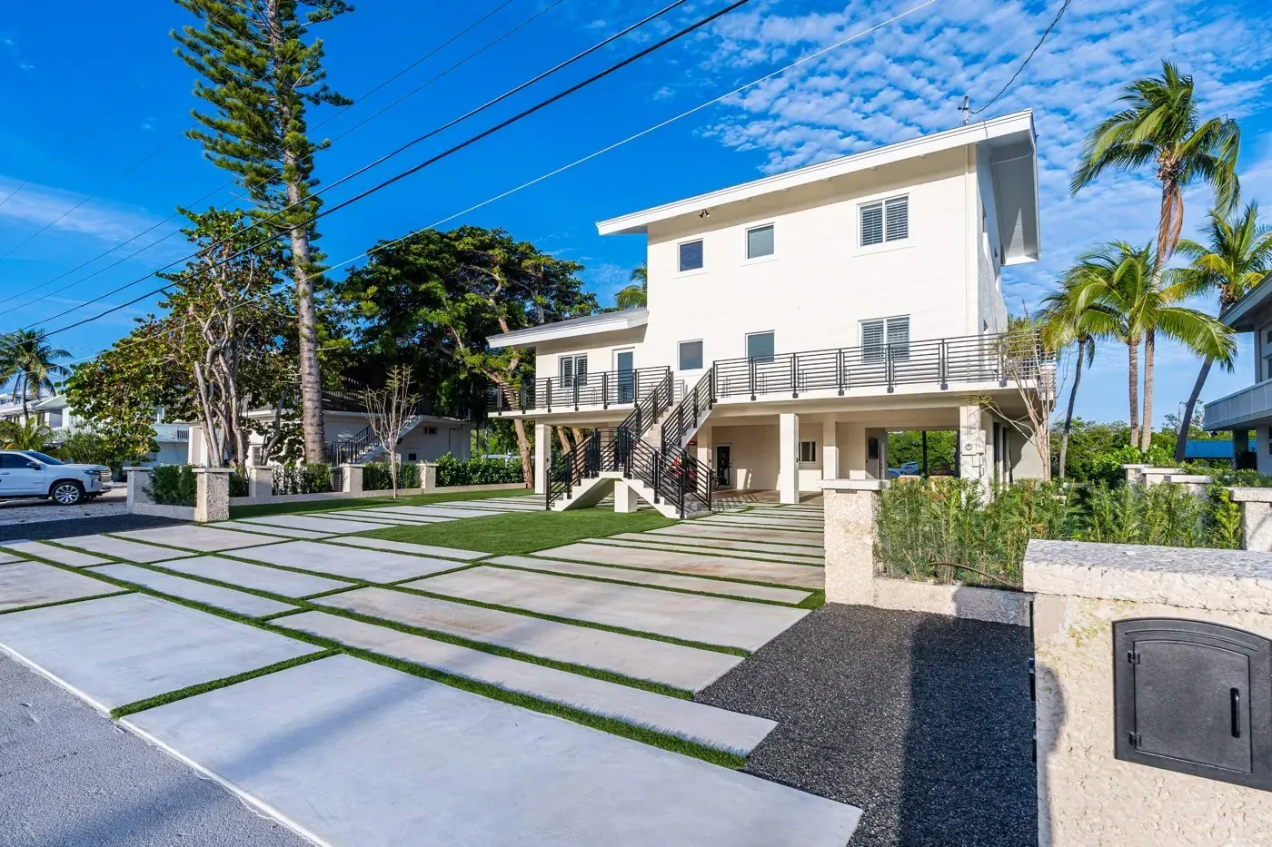 Modern home with paver driveway